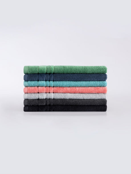 Selene Hand Towel in Denim, crafted from 550 GSM cotton, featuring plush velour stripes for style and maximum absorbency.