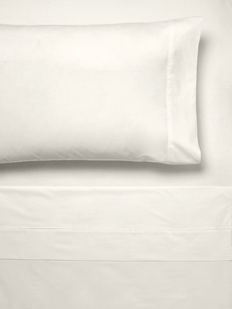 Luxurious cream Queen Sheet Set by Savona made from 300T cotton percale, includes flat and fitted sheets plus two pillowcases.