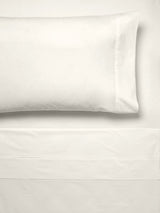 Luxurious cream king sheet set by Savona in 300T cotton percale, featuring cuffed edges for elegant comfort and style.