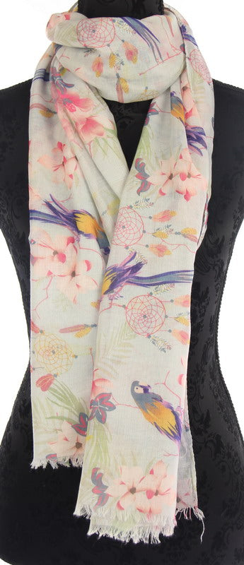 Peach floral scarf featuring a vibrant parrot design, perfect for elevating any outfit with style and flair.