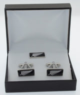 Exquisite fern-themed cufflinks and lapel pin set in black box, ideal for formal occasions and stylish personal expression.