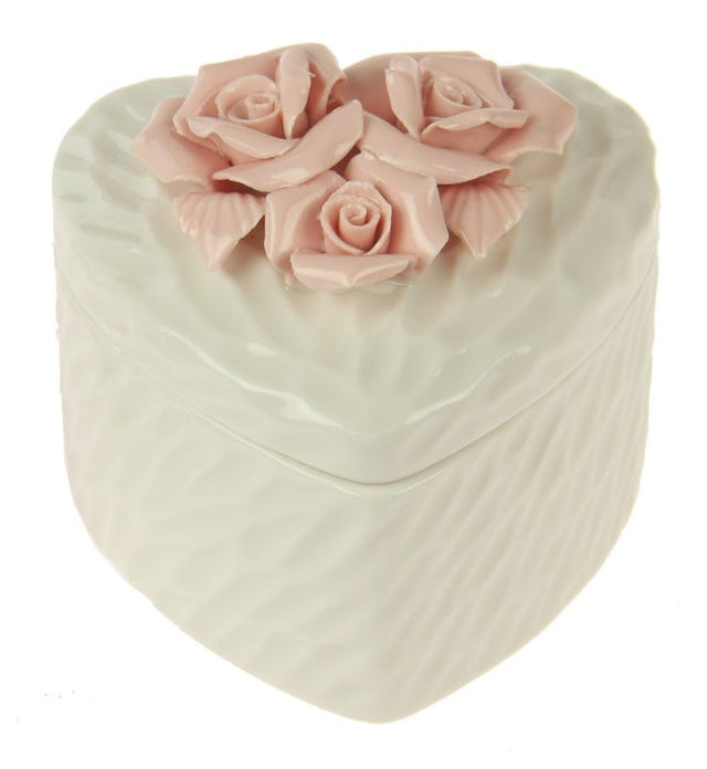 Elegant white ceramic trinket boxes with rose-embossed heart lids, perfect for storing jewelry and small treasures.