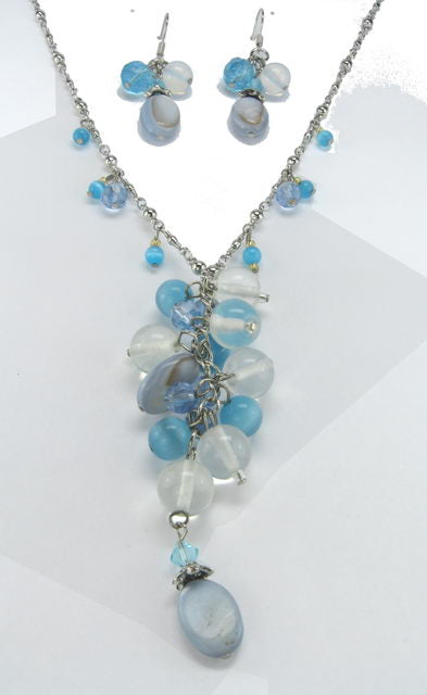 Elegant blue bead and crystal earring and necklace set, perfect for any occasion, showcasing sophistication and style.