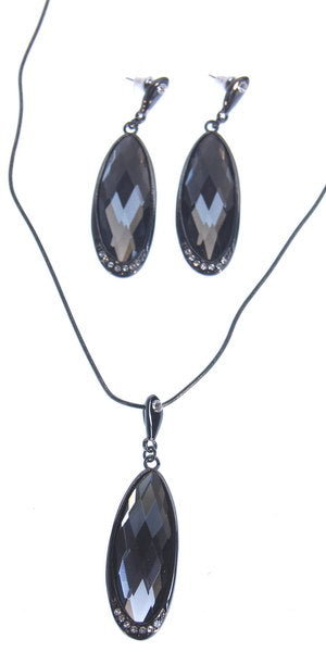 Elegant black crystal earring and necklace set with large flat oval drops, perfect for any occasion.