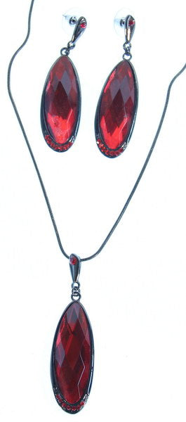 Earring and necklace set featuring large flat oval red crystal drops, perfect for adding elegance to any outfit.