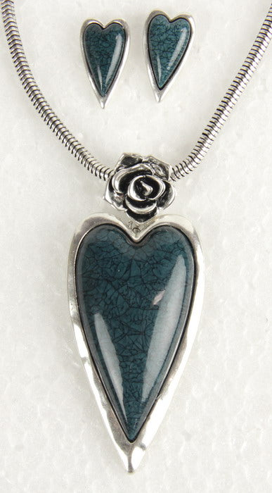 Heart-shaped teal resin earring and necklace set with rose accents, featuring an 18-inch oxidized silver snake chain.