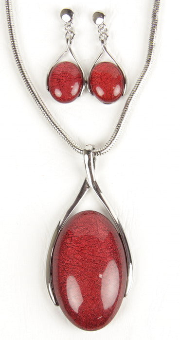 Red resin oval drop earring and necklace set with oxidized silver plating on a chic snake chain, perfect for any occasion.