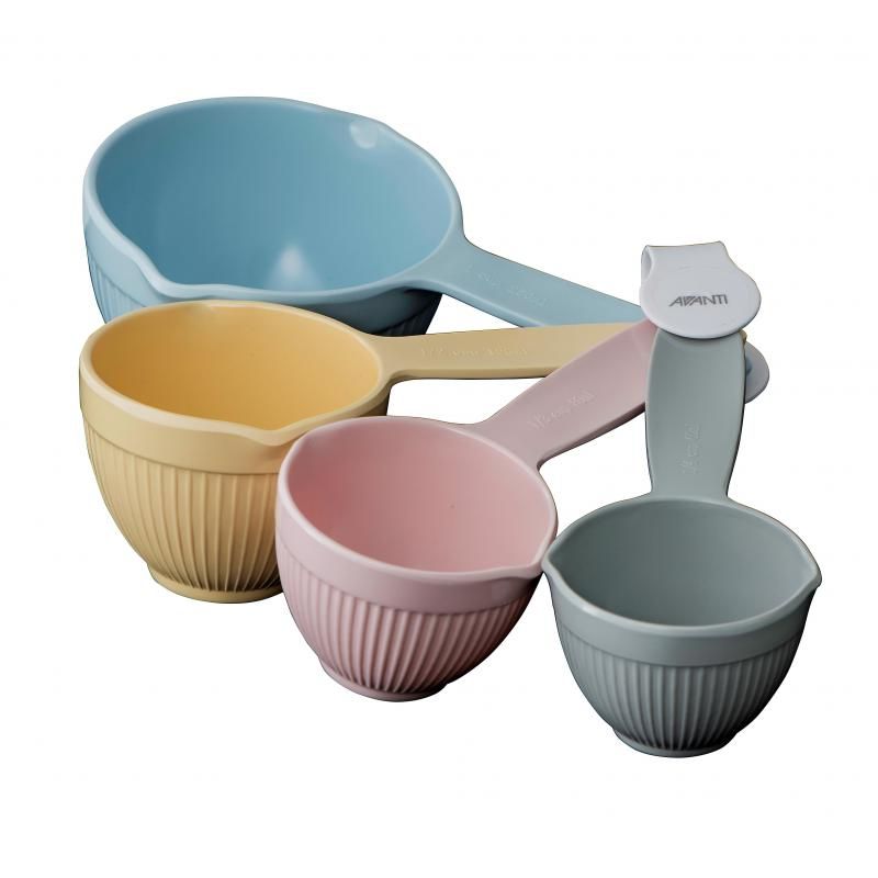 Pastel-colored ribbed measuring cups set with pouring spouts for precise measuring in baking and cooking.