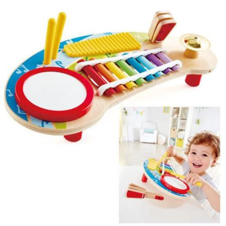 Colorful Hape Mighty Mini Band toy set with a ukulele, tambourine, clapper, rattle, and rainmaker designed for young musicians.