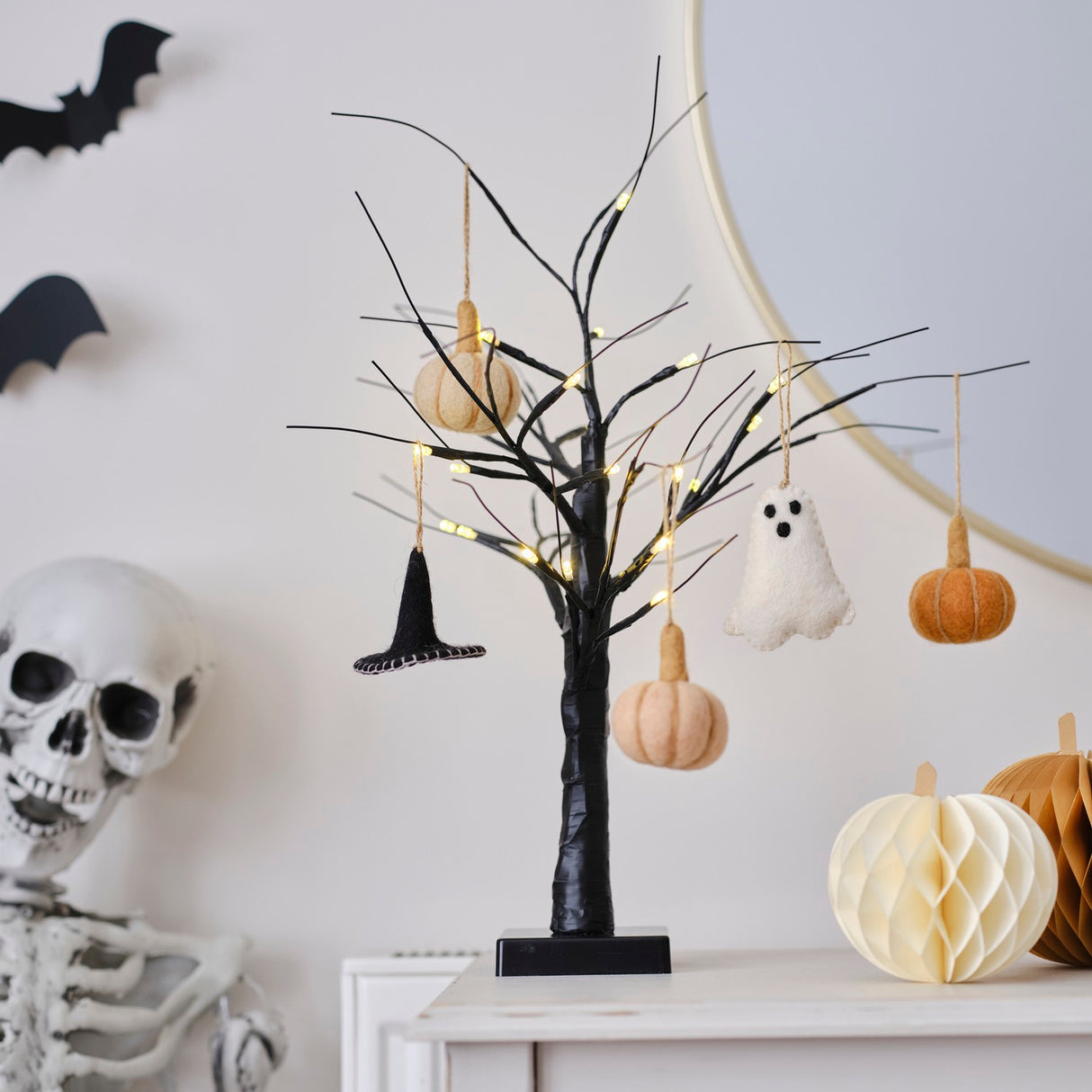 Handmade felt pumpkin tree decorations in vibrant Pumpkin Spice, perfect for eco-friendly Halloween decor.