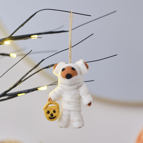 Handmade Pumpkin Spice Felt Mummy Bear decoration, 10cm tall, perfect for adding a whimsical touch to Halloween displays.