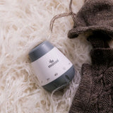 Moose Calm-a White Noise Machine in white/grey with six soothing sounds, portable for baby’s sleep environments.