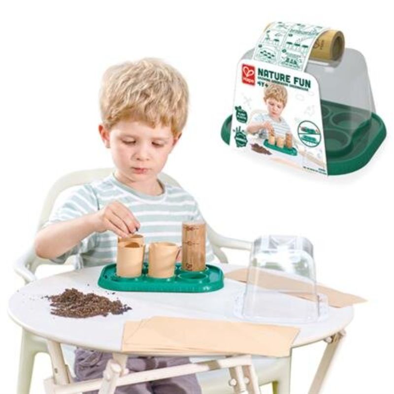 Eco-friendly Hape greenhouse playset for kids to learn about gardening, featuring bamboo and bioplastic elements.