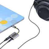 USB-C headphone splitter in space gray, connects two 3.5mm headphones, features mic input for clear calls and lossless audio.