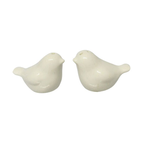 Charming white love birds salt and pepper shakers, perfect for romantic table settings, elegantly packaged in a gift box.