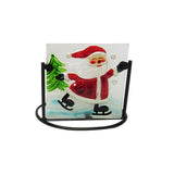 Festive tealight holder featuring a stained glass Santa in a black metal frame, perfect for holiday decor.