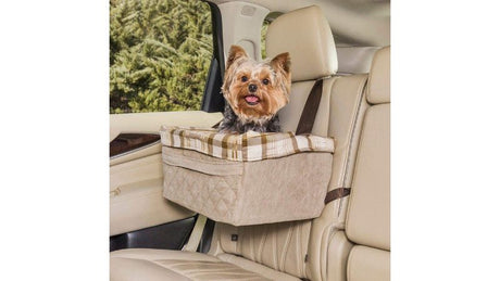 "Dogs in a quilted booster seat, providing comfort and an unobstructed view while traveling in a vehicle."