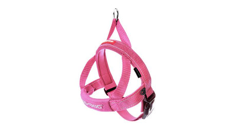 Comfortable pink dog harness with quick fit design, reflective stitching, and secure leash ring for large breeds.