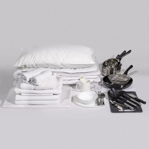 Quikit All-in-One Essentials Kit featuring bedding, bath, and kitchen items for convenience and style in your living space.