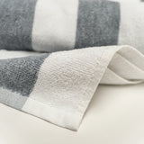 Grey and white striped pool towel, 75x150cm, 420gsm, made from 80% cotton, perfect for lounging by the pool.