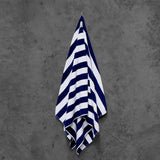 Navy and white striped pool towel, soft and absorbent 100% cotton, 75cm x 150cm, durable with double-stitched hems.