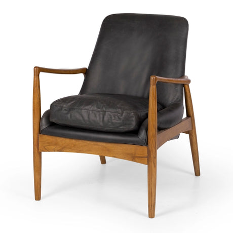 Stylish mid-century modern armchair in black leather with a smoked oak frame and plush duck feather cushioning.