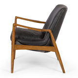 Mid-century modern Steiner armchair in black leather with smoked oak frame and duck feather cushioning for ultimate comfort.