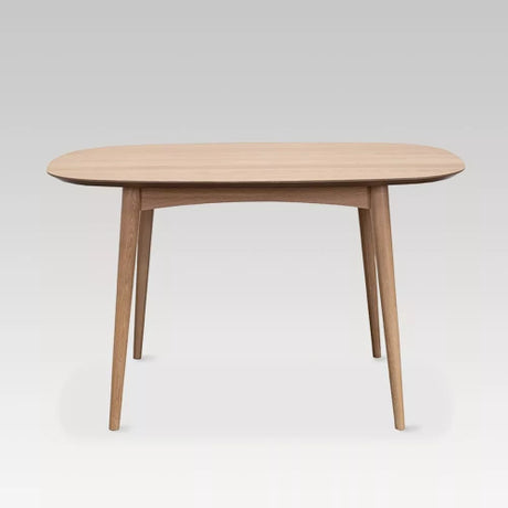 Elegant Oslo Table (1.29m x 85cm) in solid oak, perfect for dining gatherings, blending Scandinavian and retro design.