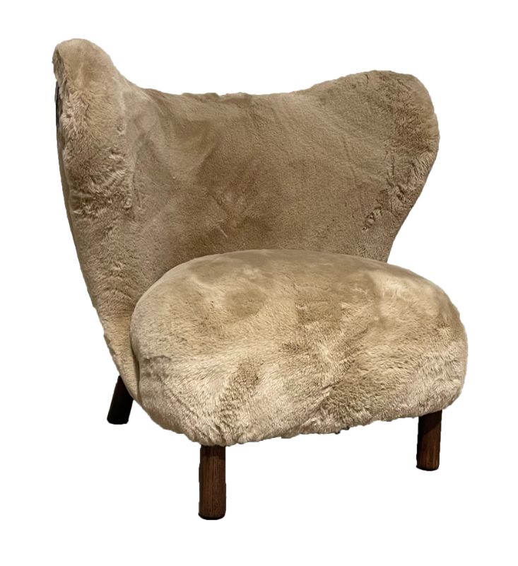 Luxurious Sherpa armchair with a modern design, perfect for cozy reading or movie nights in any living space.