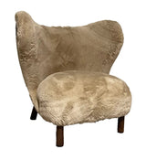 Luxurious Sherpa armchair with a modern design, perfect for cozy reading or movie nights in any living space.