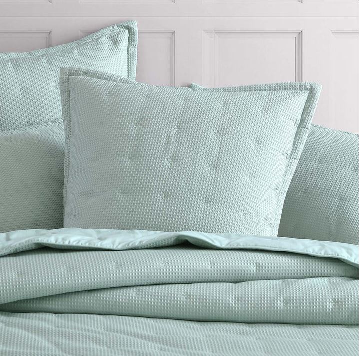 Textured waffle weave European pillowcase in versatile colors, featuring tailored edges for elegant bedroom decor.