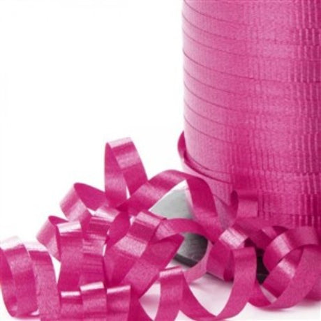 Vibrant hot pink curling ribbon, 450m long and 5mm wide, perfect for gift wrapping and party decorations.