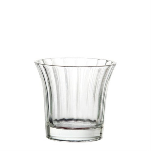 Clear glass tea light holder with a shot flared shape, perfect for creating warm, inviting ambiance in any decor.