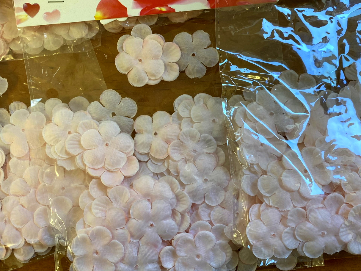 Vibrant pink flower petals in 6 packs, perfect for weddings and events, made from biodegradable materials. Clearance price!