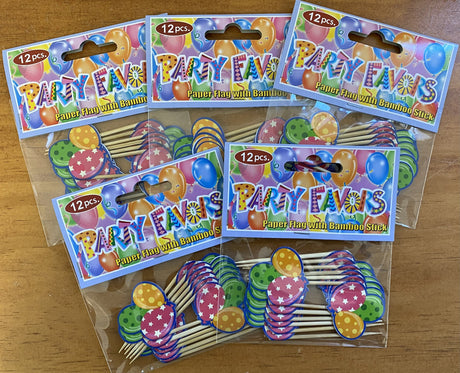 Colorful cupcake picks featuring balloon designs, perfect for adding a festive touch to desserts at celebrations.