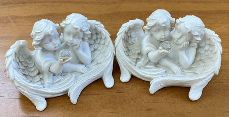 Set of 2 delicate 7.5cm cherub ornaments, perfect for adding charm to your holiday decor and tree displays.