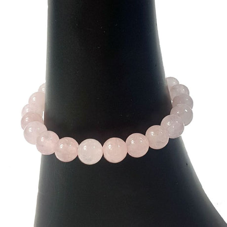 Set of 3 polished 8mm rose quartz bead bracelets, promoting love and healing energy with stylish versatility.