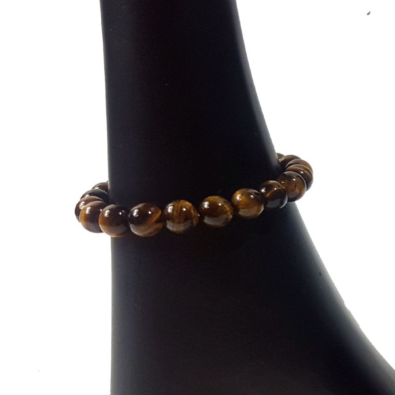 Set of 3 handcrafted Tigers Eye bead bracelets, each 8mm, promoting positive energy and stylish versatility.