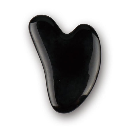 Heart-shaped obsidian Gua Sha plate (7.8cm) for facial massage, promoting circulation and anti-aging benefits.