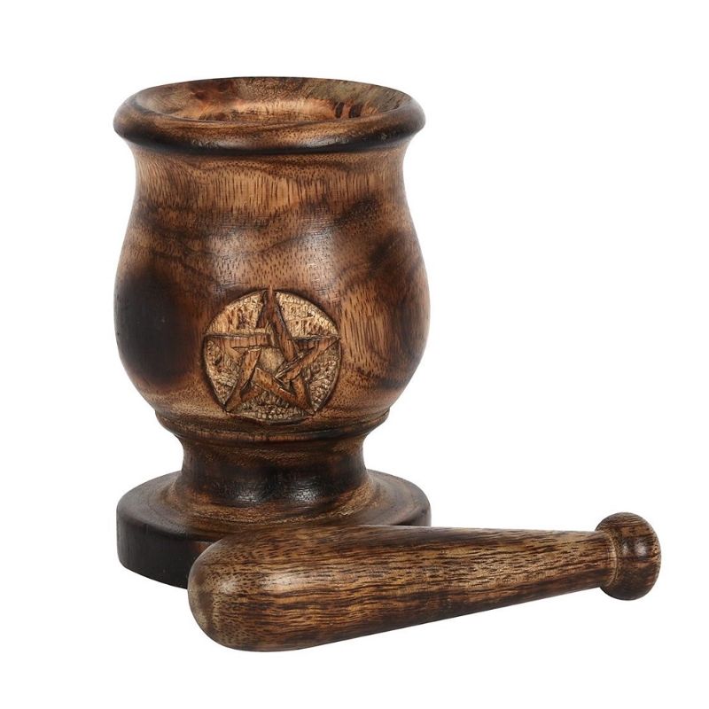 Handcrafted 5-inch mango wood mortar and pestle with carved pentagram design, perfect for herbs and rituals.