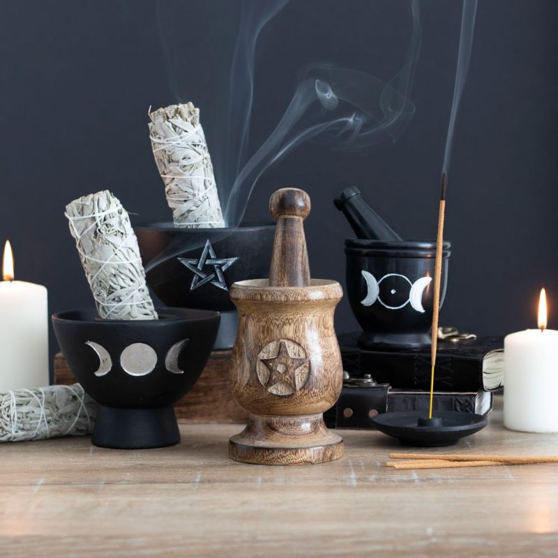 Handcrafted pentagram mortar and pestle made of mango wood, perfect for grinding herbs and adding a mystical touch to rituals.