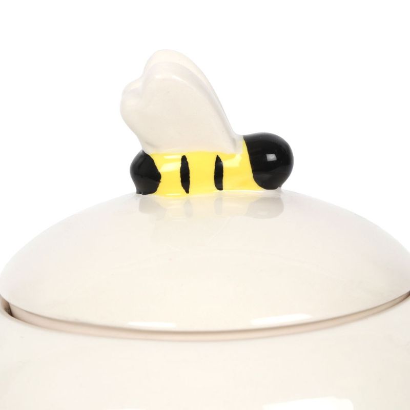 Bee Happy Ceramic Storage Jar in beehive shape, featuring a 3D bee lid and 'Bee Happy' message, perfect for treats storage.