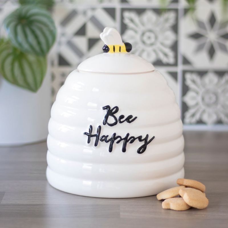 Bee Happy Ceramic Storage Jar with beehive design, uplifting message, and 3D bee lid for cheerful kitchen decor.