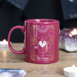 Ceramic mug in pink with white and gold foil Lovers tarot design, 350ml capacity, dishwasher and microwave safe.