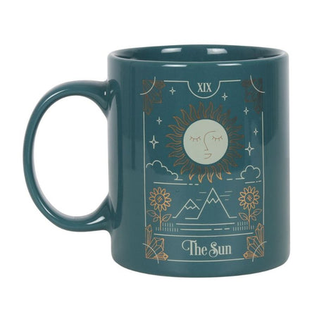 Ceramic mug featuring The Sun tarot design in green, white, and gold, perfect for coffee or tea, 350ml capacity.