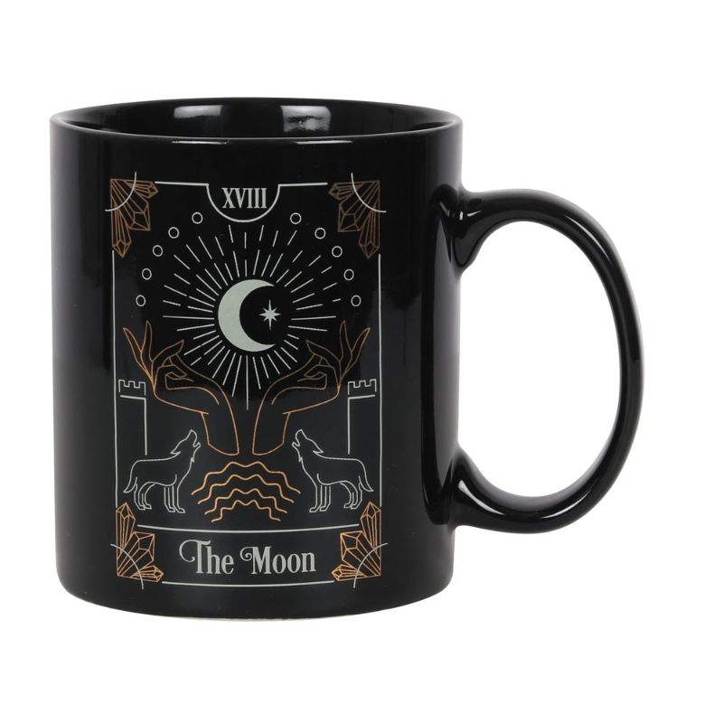 Black ceramic mug featuring a gold and white illustration of The Moon, ideal for tea and coffee lovers.