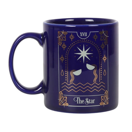 Ceramic mug featuring a gold-foiled Star tarot design on a deep blue background, perfect for hot beverages.