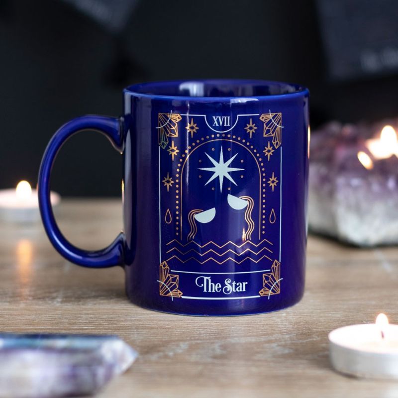 Ceramic mug featuring the "Star" tarot design in white and gold on a deep blue background, 350ml capacity.