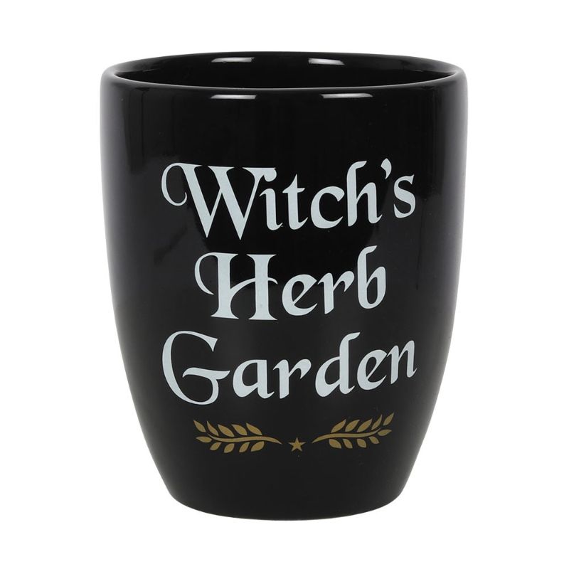 Ceramic plant pot with 'Witch's Herb Garden' text and leaf design, perfect for growing magical herbs indoors.