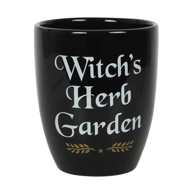 Ceramic plant pot with 'Witch's Herb Garden' text and leaf design, perfect for growing magical herbs indoors.
